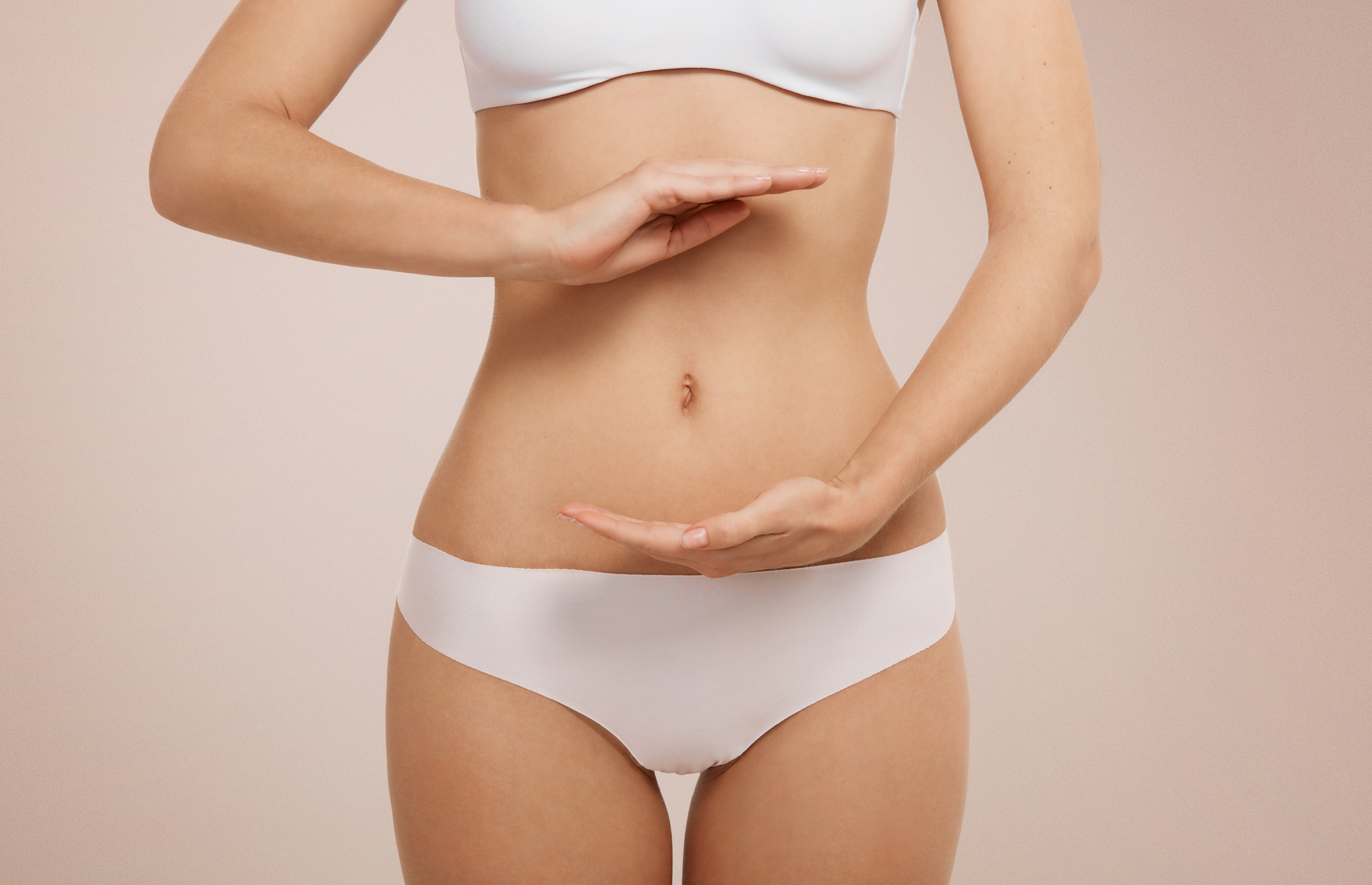 Woman Showing Sign Bio Balance On Her Stomach Isolated